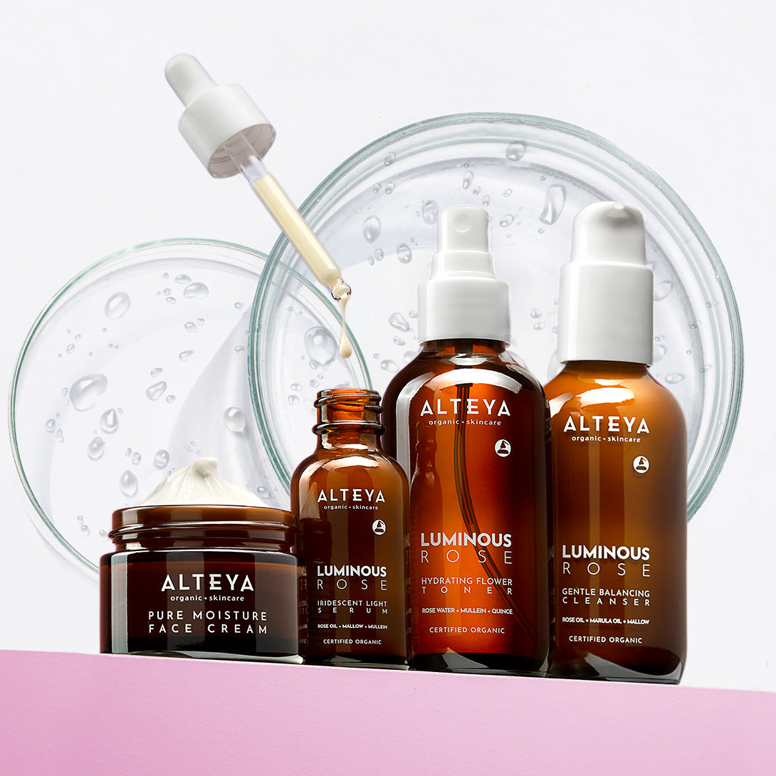 Aetna skincare products featuring Bulgarian Rose on a pink background.