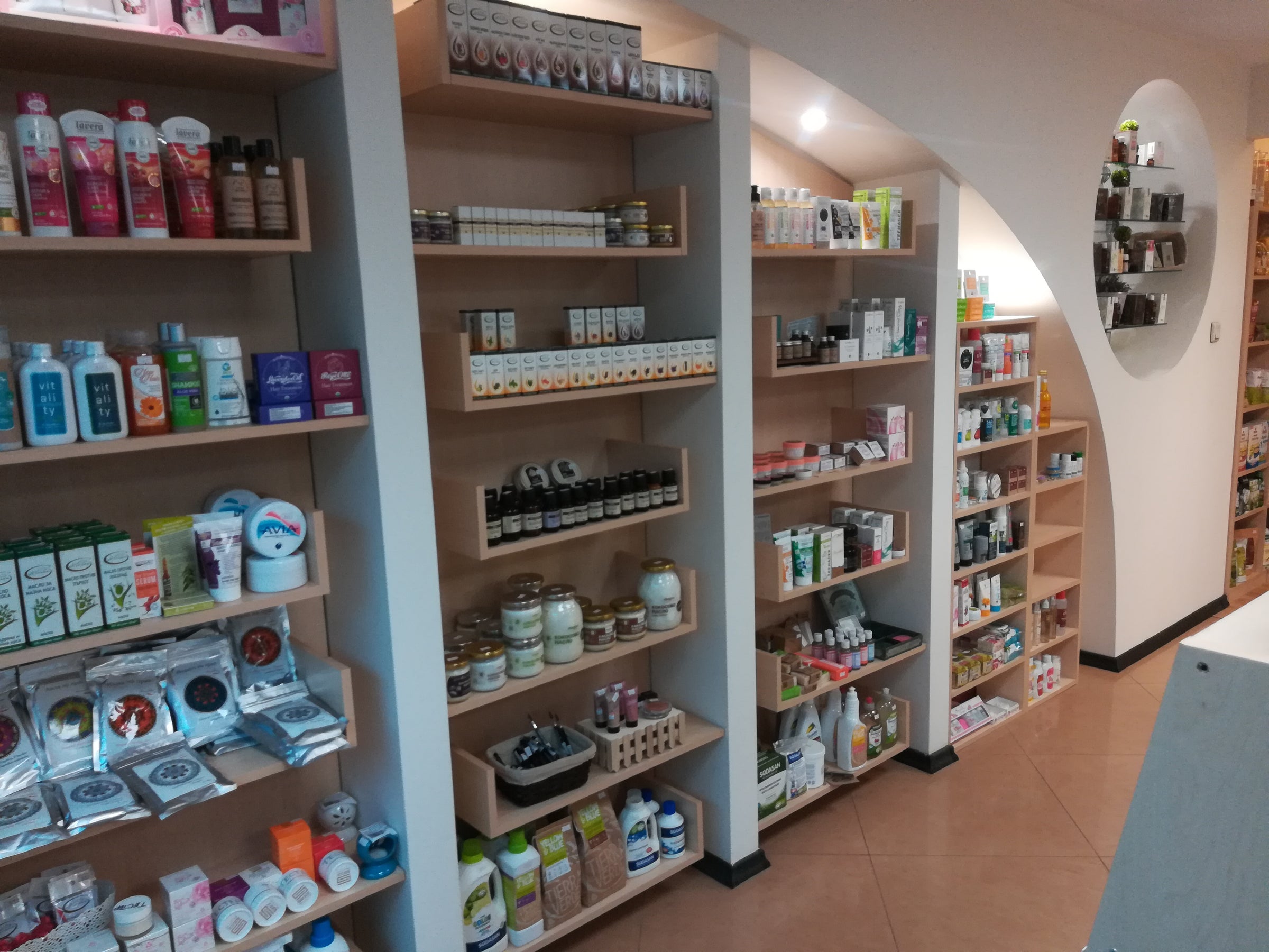 A store with shelves full of different types of Bulgarian rose products featuring rosa damascena sourced from Alteya.