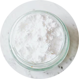 A glass jar with white powder.
