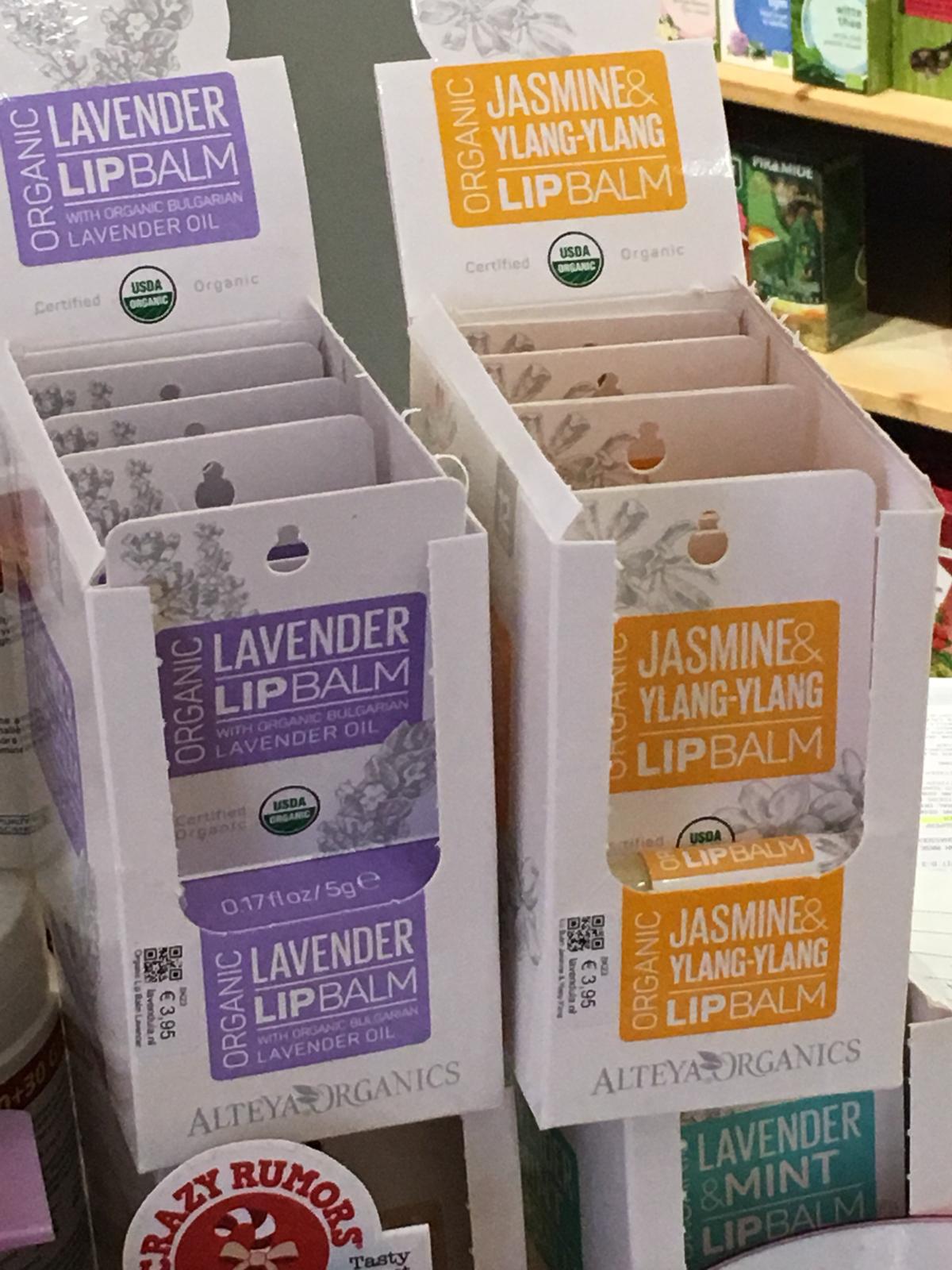 Alteya's Jasmine lip balm, infused with the enchanting aroma of Rosa Damascena, can be found in a store nestled amidst picturesque rose fields.