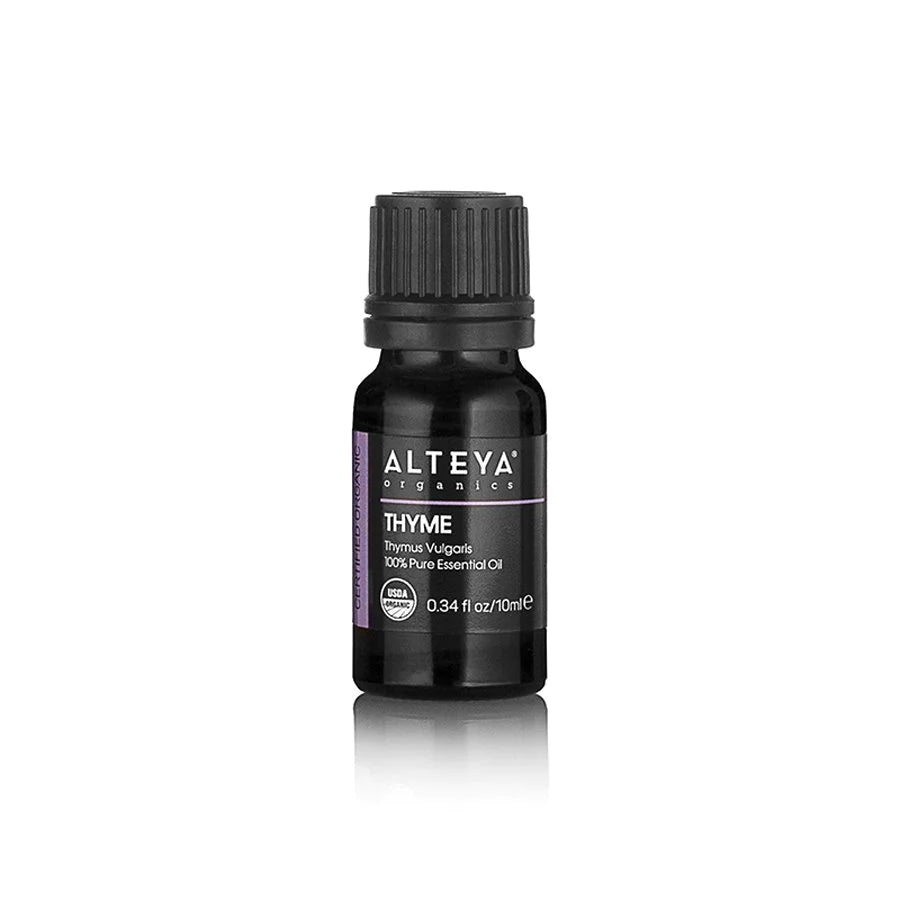 A bottle of Thyme Essential Oil /Thymus Vulgaris/, a natural antiseptic, on a white background.
