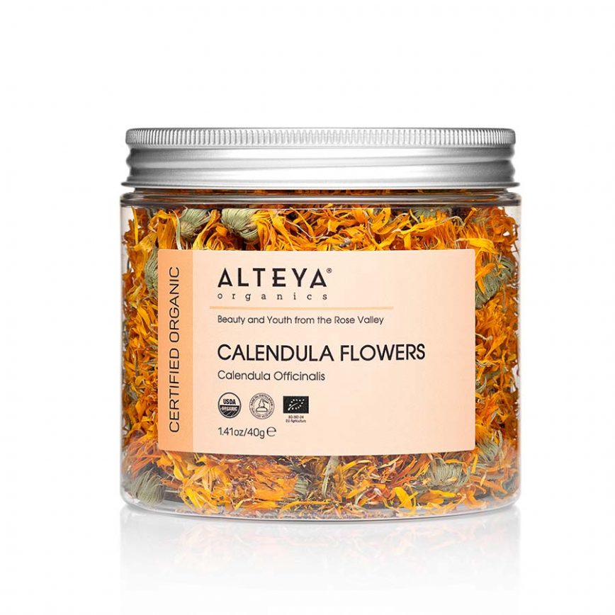 A jar of Dry Calendula Flowers, known for their healing properties, on a white background.